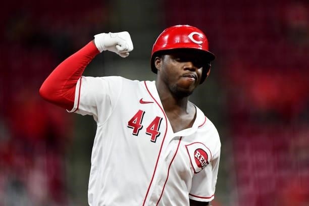 Aristides Aquino of the Cincinnati Reds celebrates his solo home run in the ninth inning during their game against the Milwaukee Brewers at Great...