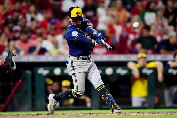 Luis Urias of the Milwaukee Brewers hits a solo home run in the eighth inning during their game against the Cincinnati Reds at Great American Ball...