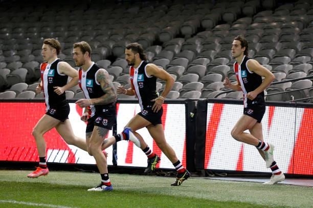 St Kilda players run out before the round 18 AFL match between St Kilda Saints and Port Adelaide Power at Marvel Stadium on July 17, 2021 in...