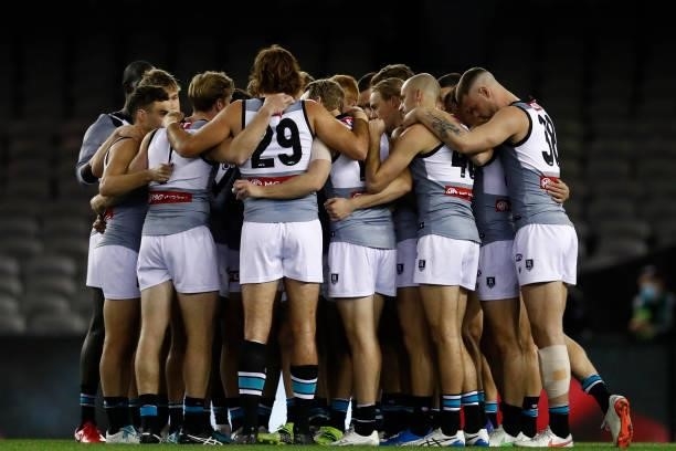 Port Adelaide players huddle before the round 18 AFL match between St Kilda Saints and Port Adelaide Power at Marvel Stadium on July 17, 2021 in...