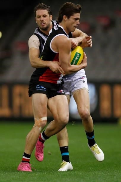 Travis Boak of the Power tackles Jack Steele of the Saints during the round 18 AFL match between St Kilda Saints and Port Adelaide Power at Marvel...