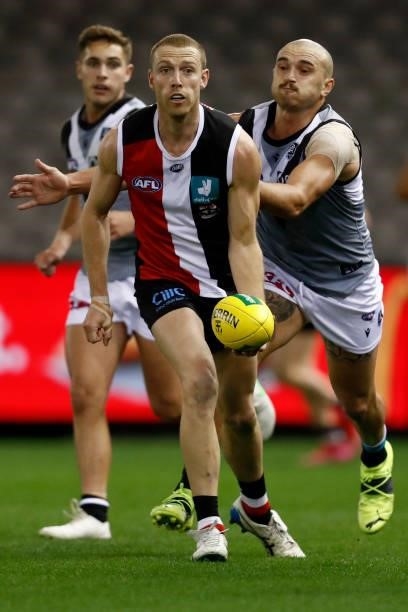Callum Wilkie of the Saints handballs during the round 18 AFL match between St Kilda Saints and Port Adelaide Power at Marvel Stadium on July 17,...