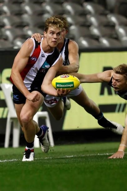 Thomas Highmore of the Saints handballs during the round 18 AFL match between St Kilda Saints and Port Adelaide Power at Marvel Stadium on July 17,...