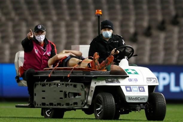 Daniel McKenzie of the Saints is stretchered from the ground during the round 18 AFL match between St Kilda Saints and Port Adelaide Power at Marvel...