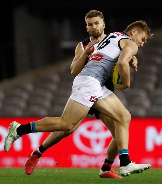 Dan Butler of the Saints tackles Ollie Wines of the Power during the round 18 AFL match between St Kilda Saints and Port Adelaide Power at Marvel...