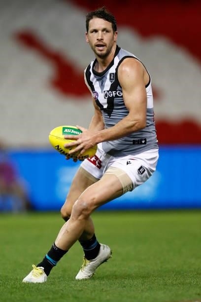 Travis Boak of the Power runs with the ball during the round 18 AFL match between St Kilda Saints and Port Adelaide Power at Marvel Stadium on July...