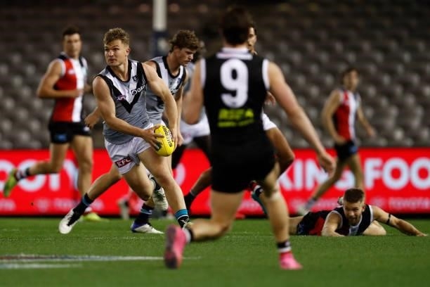 Ollie Wines of the Power runs with the ball during the round 18 AFL match between St Kilda Saints and Port Adelaide Power at Marvel Stadium on July...