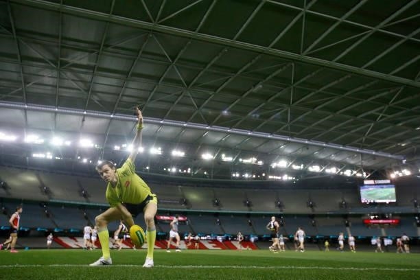 Boundary umpire throws the ball in during the round 18 AFL match between St Kilda Saints and Port Adelaide Power at Marvel Stadium on July 17, 2021...