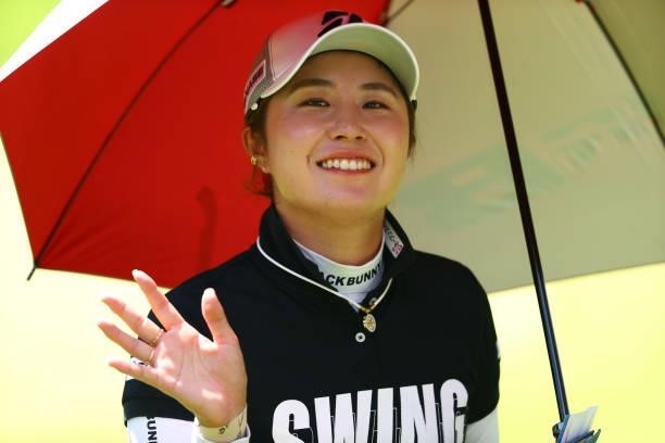Momoko Osato of Japan waves on the 18th green during the second round of the GMO Internet Ladies Samantha Thavasa Global Cup at Eagle Point Golf Club...