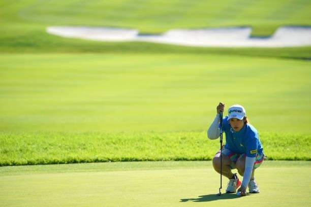 Mayu Hamada of Japan lines up a putt on the 18th green during the second round of the GMO Internet Ladies Samantha Thavasa Global Cup at Eagle Point...