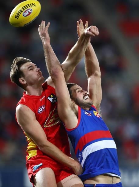 Caleb Graham of the Suns and Josh Bruce of the Bulldogs compete for the ball during the round 18 AFL match between Gold Coast Suns and Western...