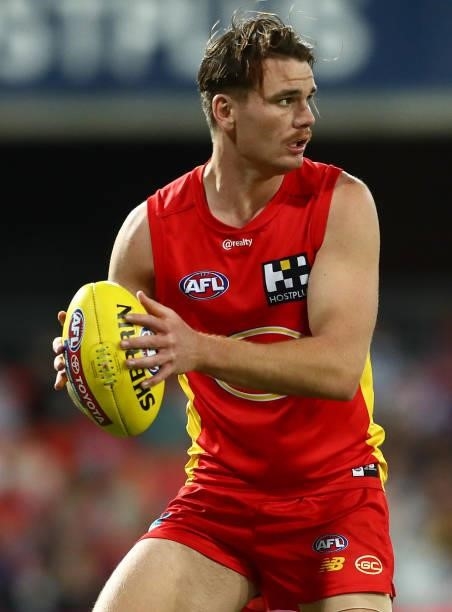Caleb Graham of the Suns controls the ball during the round 18 AFL match between Gold Coast Suns and Western Bulldogs at Metricon Stadium on July 17,...