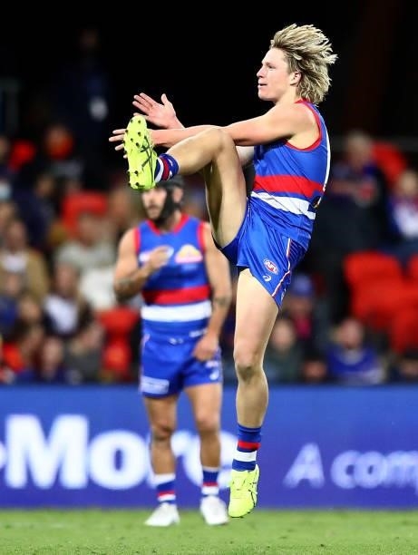 Cody Weightman of the Bulldogs kicks on goal during the round 18 AFL match between Gold Coast Suns and Western Bulldogs at Metricon Stadium on July...