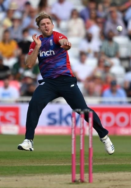 David Willey of England throws at the stumps during the second Vitality International T20 match between England and Pakistan at Trent Bridge on July...