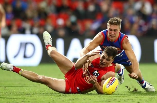 Ben Ainsworth of the Suns looks to get the ball during the round 18 AFL match between Gold Coast Suns and Western Bulldogs at Metricon Stadium on...