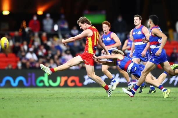 Noah Anderson of the Suns kicks the ball during the round 18 AFL match between Gold Coast Suns and Western Bulldogs at Metricon Stadium on July 17,...