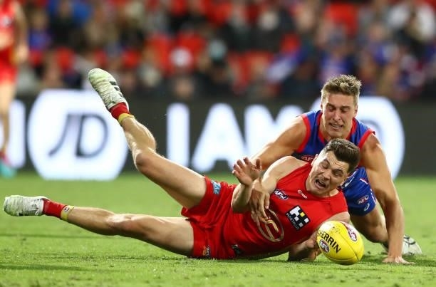 Ben Ainsworth of the Suns looks to get the ball during the round 18 AFL match between Gold Coast Suns and Western Bulldogs at Metricon Stadium on...