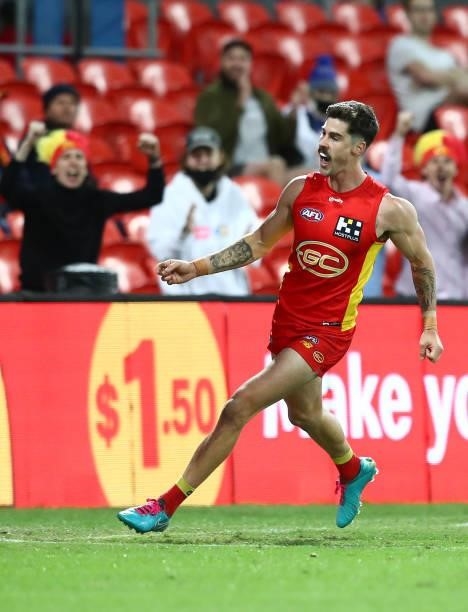 Alex Sexton of the Suns celebrates after scoring a goal during the round 18 AFL match between Gold Coast Suns and Western Bulldogs at Metricon...