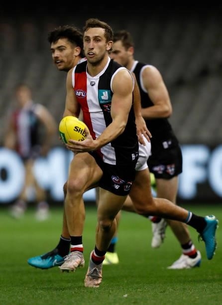Luke Dunstan of the Saints runs with the ball during the round 18 AFL match between St Kilda Saints and Port Adelaide Power at Marvel Stadium on July...