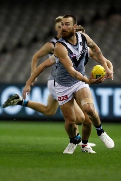 Charlie Dixon of the Power runs with the ball during the round 18 AFL match between St Kilda Saints and Port Adelaide Power at Marvel Stadium on July...
