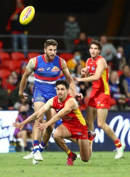 Marcus Bontempelli of the Bulldogs kicks the ball during the round 18 AFL match between Gold Coast Suns and Western Bulldogs at Metricon Stadium on...
