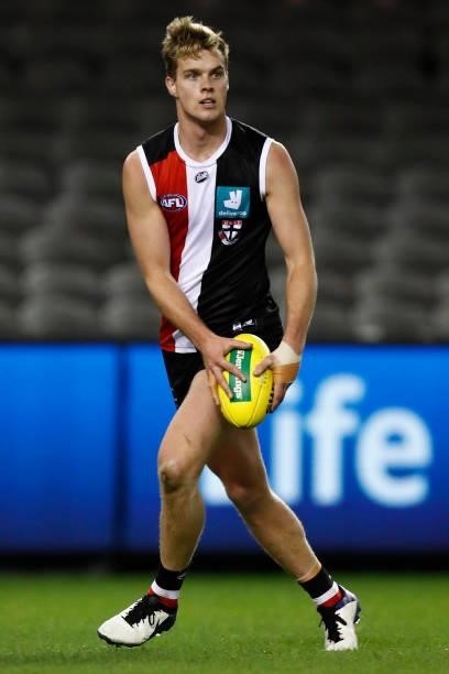 Thomas Highmore of the Saints runs with the ball during the round 18 AFL match between St Kilda Saints and Port Adelaide Power at Marvel Stadium on...