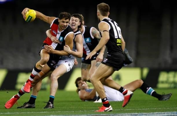 Darcy Byrne-Jones of the Power tackles Paddy Ryder of the Saints during the round 18 AFL match between St Kilda Saints and Port Adelaide Power at...