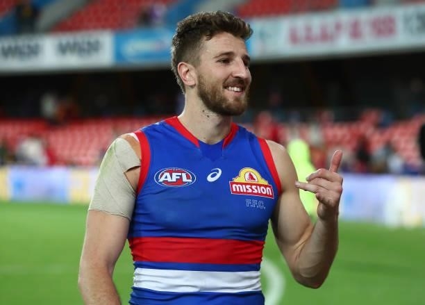 Marcus Bontempelli of the Bulldogs waves to the crowd after the Bulldogs defeated the Suns during the round 18 AFL match between Gold Coast Suns and...