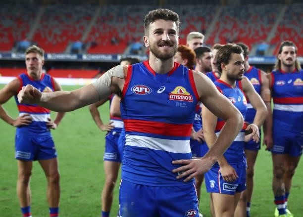 Marcus Bontempelli of the Bulldogs waves to the crowd after the Bulldogs defeated the Suns during the round 18 AFL match between Gold Coast Suns and...