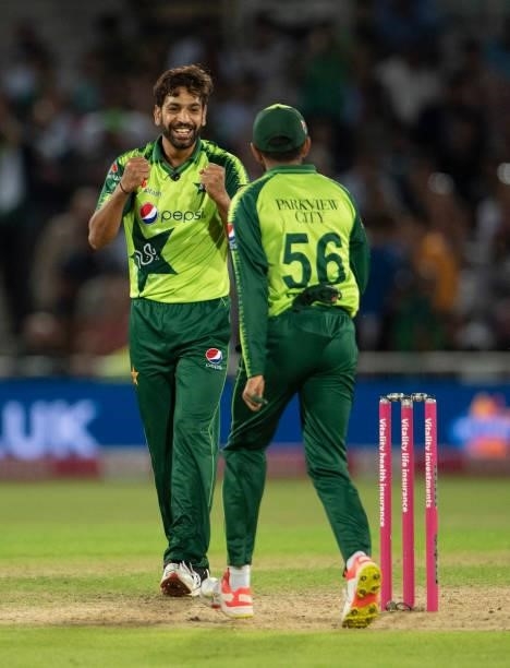 Haris Rauf of Pakistan celebrates with Babar Azam after getting the wicket of David Willey of England during the 1st T20I between England and...