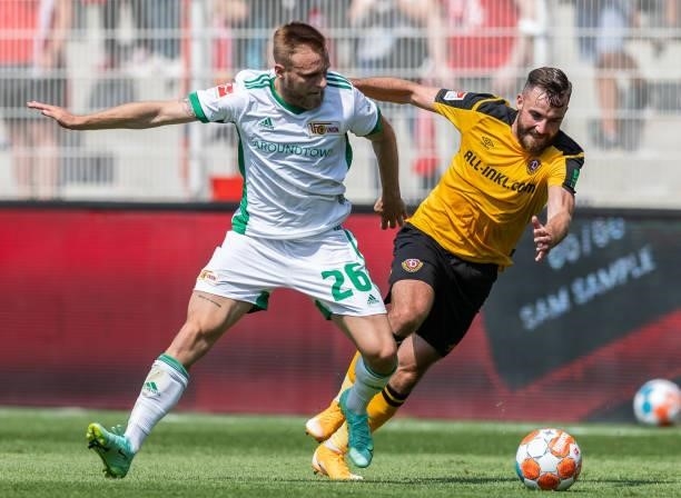 Tymoteusz Puchacz of 1.FC Union Berlin is challenged by Morris Schroeter of Dynamo Dresden during the Pre-Season friendly match between 1. FC Union...