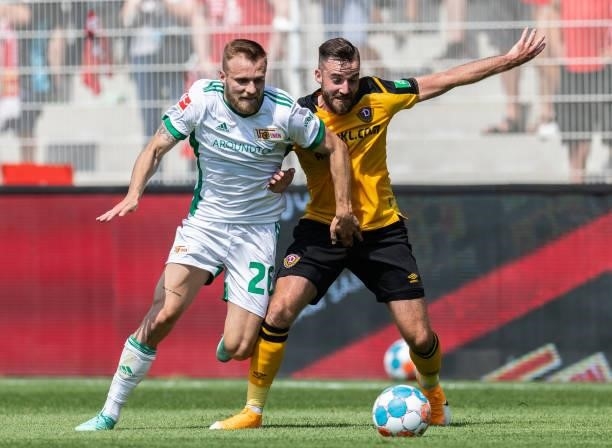 Tymoteusz Puchacz of 1.FC Union Berlin is challenged by Morris Schroeter of Dynamo Dresden during the Pre-Season friendly match between 1. FC Union...