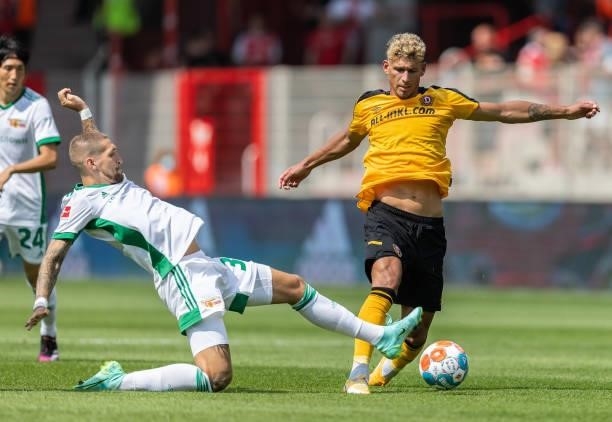 Heinz Moerschel of Dynamo Dresde is tackled by Robert Andrich of 1.FC Union Berlin during the Pre-Season friendly match between 1. FC Union Berlin...
