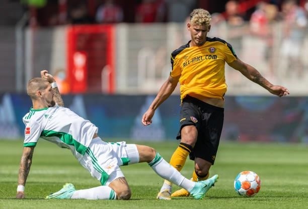 Heinz Moerschel of Dynamo Dresde is tackled by Robert Andrich of 1.FC Union Berlin during the Pre-Season friendly match between 1. FC Union Berlin...