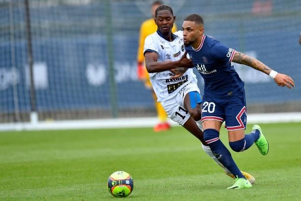 Layvin Kurzawa of Paris Saint-Germain fights for possession during the friendly match between Paris Saint-Germain and FC Chambly at Ooredoo Center on...