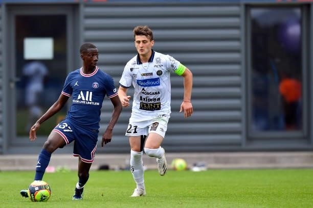 Bandiougou Fadiga of Paris Saint-Germain runs with the ball during the friendly match between Paris Saint-Germain and FC Chambly at Ooredoo Center on...