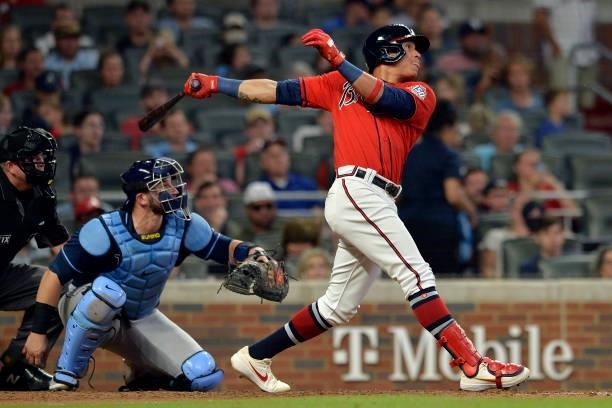 Ehire Adrianza of the Atlanta Braves bats during a game against the Tampa Bay Rays at Truist Park on July 16, 2021 in Atlanta, Georgia.