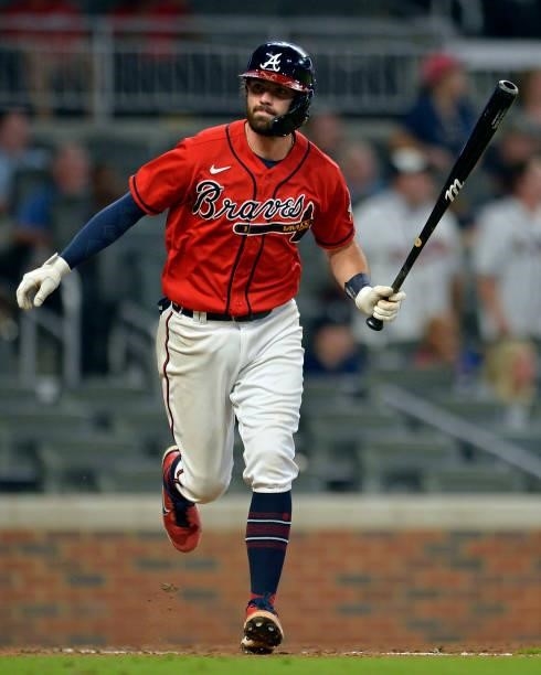 Dansby Swanson of the Atlanta Braves heads to first base during a game against the Tampa Bay Rays at Truist Park on July 16, 2021 in Atlanta, Georgia.