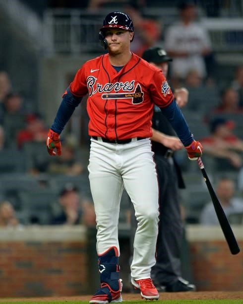 Joc Pederson of the Atlanta Braves looks back at the dugout during a game against the Tampa Bay Rays at Truist Park on July 16, 2021 in Atlanta,...