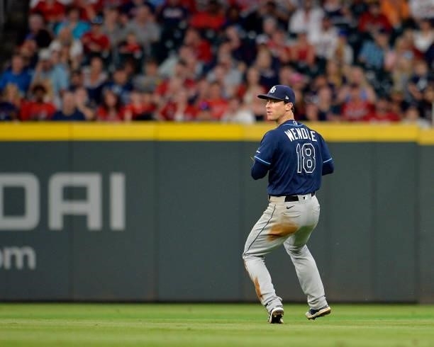 Joey Wendle of the Tampa Bay Rays fields a line drive during a game against the Atlanta Braves at Truist Park on July 16, 2021 in Atlanta, Georgia.