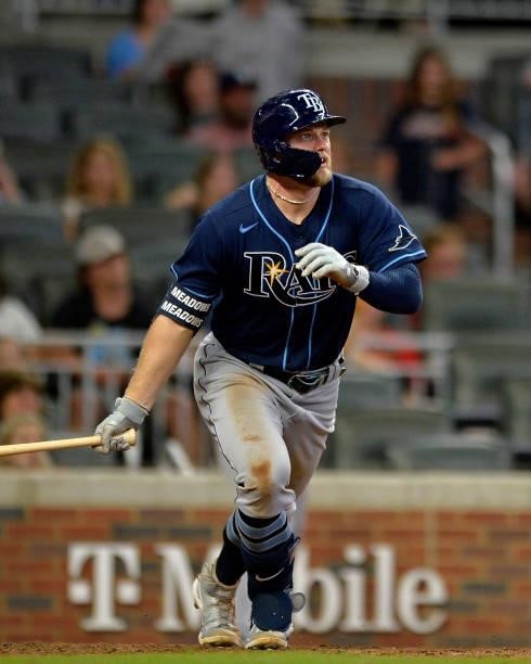 Austin Meadows of the Tampa Bay Rays runs to first base during a game against the Atlanta Braves at Truist Park on July 16, 2021 in Atlanta, Georgia.