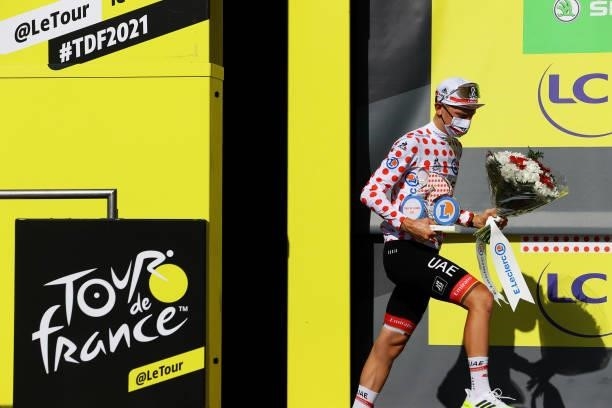Tadej Pogačar of Slovenia and UAE-Team Emirates Polka Dot Mountain Jersey celebrates at podium during the 108th Tour de France 2021, Stage 20 a...