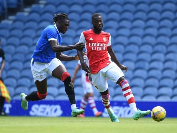 Nicolas Pepe of Arsenal takes on Calvin Bassey of Rangers during the pre season friendly between Rangers and Arsenal at Ibrox Stadium on July 17,...