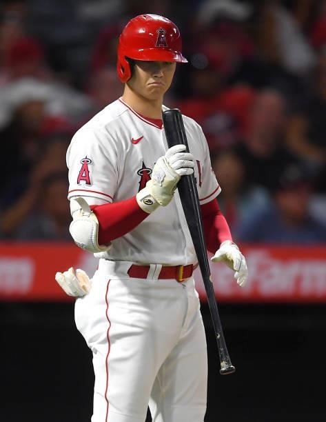 Shohei Ohtani of the Los Angeles Angels checks his bat in the game against the Seattle Mariners at Angel Stadium of Anaheim on July 16, 2021 in...