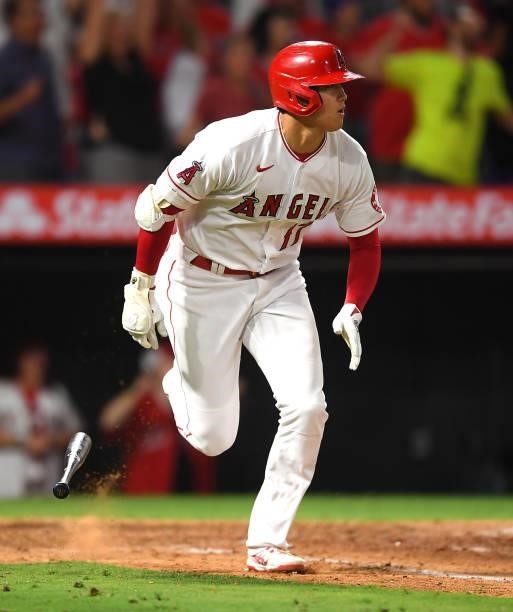 Shohei Ohtani of the Los Angeles Angels singles in two runs in the ninth inning against the Seattle Mariners at Angel Stadium of Anaheim on July 16,...
