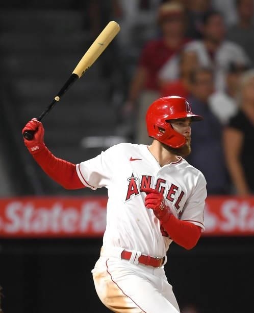 Jared Walsh of the Los Angeles Angels hits a single in the ninth inning against the Seattle Mariners at Angel Stadium of Anaheim on July 16, 2021 in...