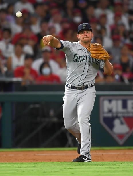Kyle Seager of the Seattle Mariners throws to first for an out during the game against the Los Angeles Angels at Angel Stadium of Anaheim on July 16,...
