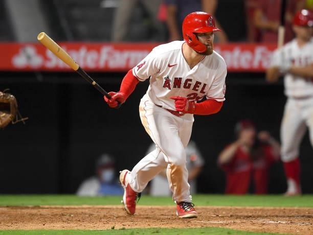 Jared Walsh of the Los Angeles Angels hits a single in the ninth inning against the Seattle Mariners at Angel Stadium of Anaheim on July 16, 2021 in...