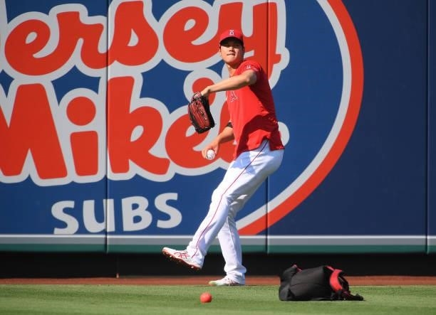 Shohei Ohtani of the Los Angeles Angels throws in the outfield before the game against the Seattle Mariners at Angel Stadium of Anaheim on July 16,...