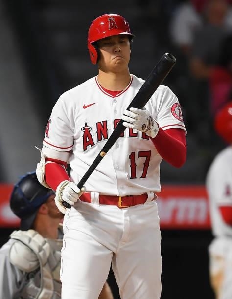Shohei Ohtani of the Los Angeles Angels checks his bat in the game against the Seattle Mariners at Angel Stadium of Anaheim on July 16, 2021 in...